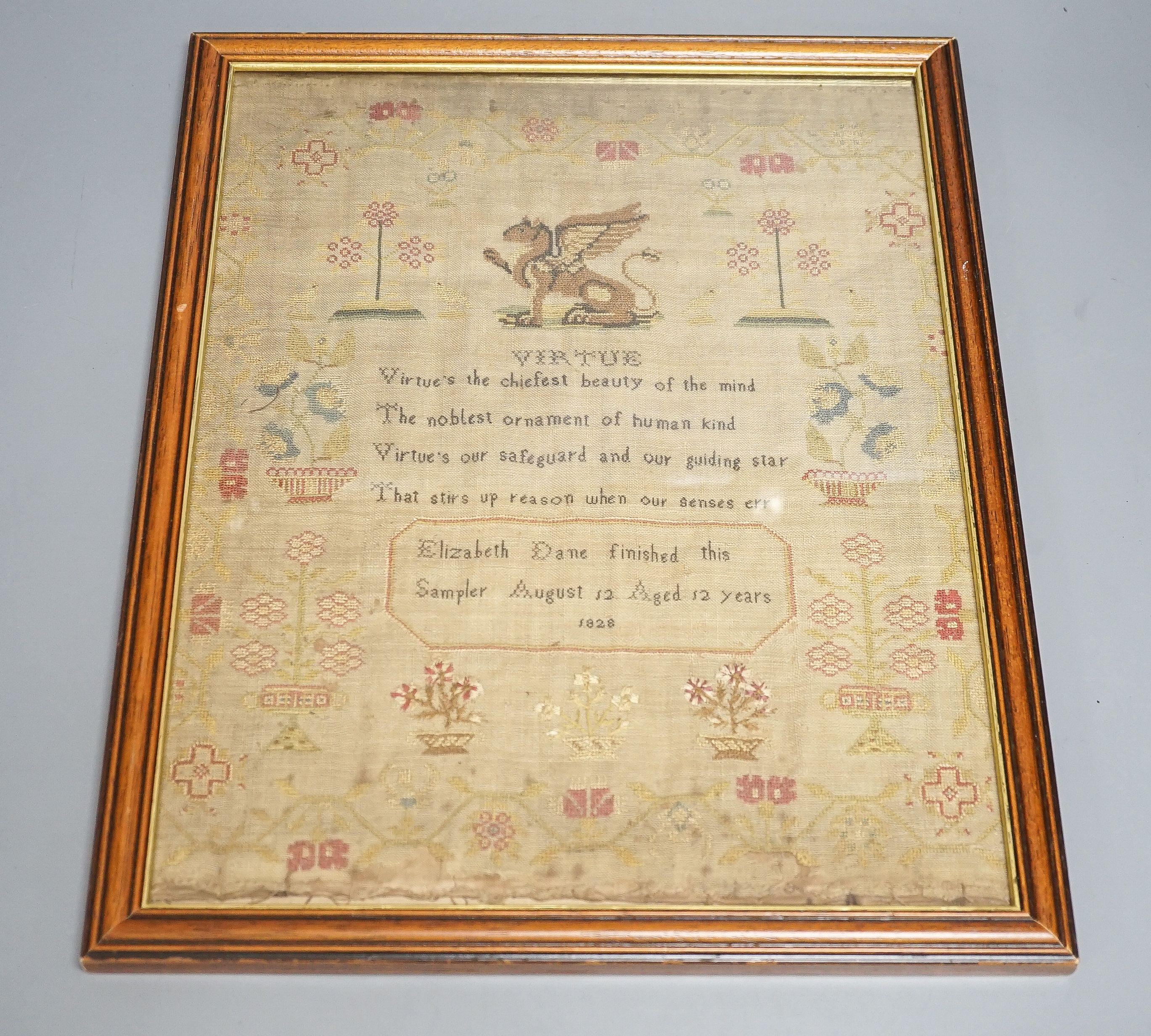 A George IV sampler dated August 12th 1828 titled ‘Virtue’ by Elizabeth Dane, framed 35x27cm